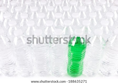 Front View of Plastic Water Bottles with One that has Green Colored Contents