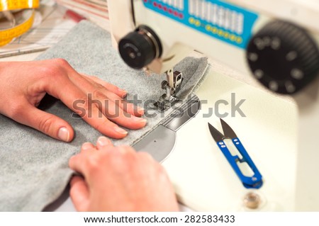 processes of sewing on the sewing machine sew women's hands sewing machine