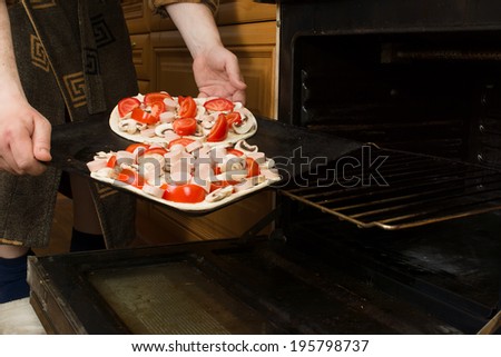 fresh juicy pizza at various stages of preparation