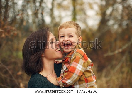 Mother and son laughing together.