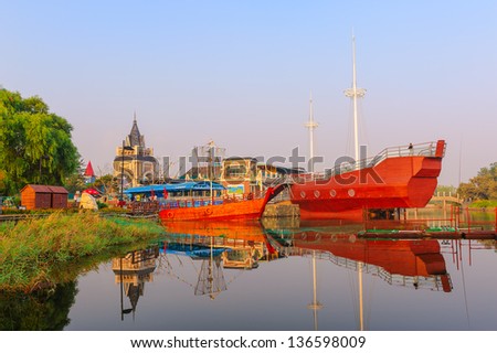The sightseeing boat .The image taken in china`s hebei province, qinhuangdao city, beidaihe district, geziwo park.The sightseeing boat stopped at the port.