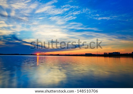 The sun setting on the lake. The photo taken in China\'s heilongjiang province daqing city Chengfeng lake.
