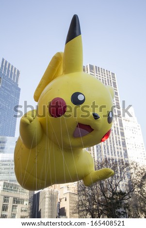 NEW YORK CITY, NY - NOVEMBER 28 : Pokemon\'s Pikachu flying through W 59th ST during the Macy\'s 87th Annual Thanksgiving Day Parade on November 28, 2013 in New York City, New York.