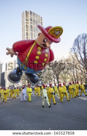 NEW YORK CITY, NY - NOVEMBER 28: Fire Department balloon in the Macy\'s 87th Annual Thanksgiving Day Parade on November 28, 2013 in New York City, New York.