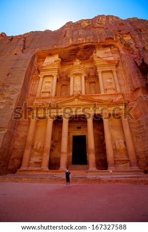 A man stands near the ancient Treasury, el-Khazneh, Petra, Jordan