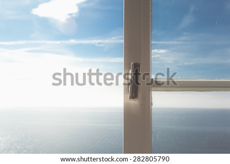 ocean view through white clear window