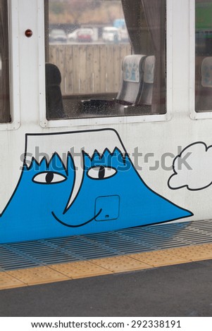 KAWAGUCHIKO, JAPAN - APRIL 14, 2015: Fuji cartoon drawing on Fujikyu  commuter train at the Kawaguchiko station. - Stock Image - Everypixel