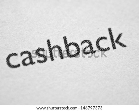 CASHBACK printed on white paper close up.