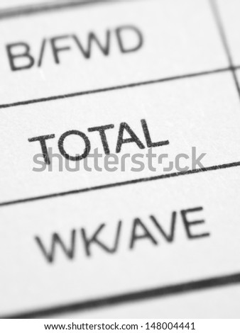 Weekly business report form closeup with TOTAL.