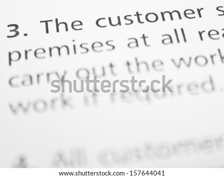 THE CUSTOMER... written on a form or contract close up.