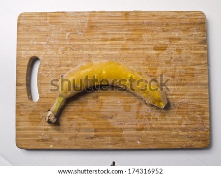 Frozen banana on chopping board