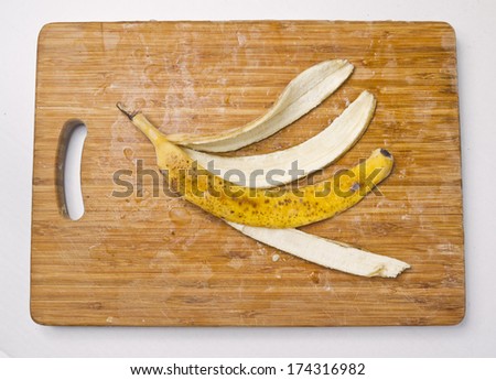 Frozen banana skin on cutting board