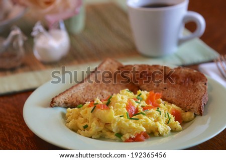 Scrambled eggs with whole wheat toast and coffee