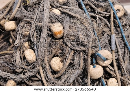 Texture of pile of fishing nets with floats. Podgora, Croatia