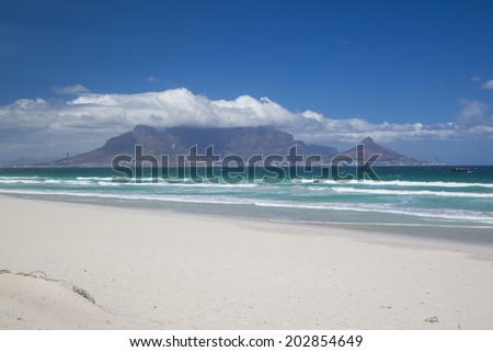 A View of Table Mountain and the City of Cape Town, South Africa. Seen from Blouberg Strand on a Hot Summers Day.