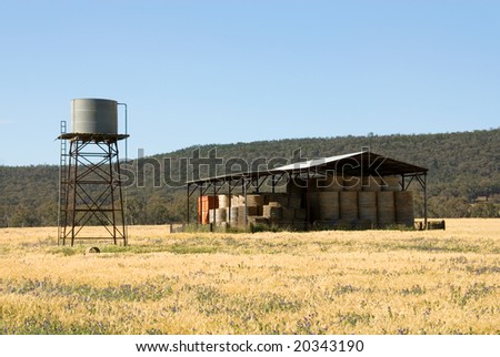 A hay shed and water tank on a farm in South-Western New South Wales, Australia