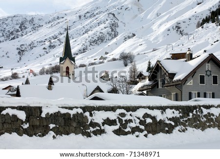 An alpine village after a heavy snowfall, Switzerland