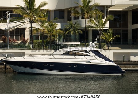 A boat moored beside a luxury home, Surfers Paradise, Queensland, Australia