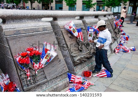 WASHINGTON, D.C. - MAY 27, 2013: People visit and lay flowers at the United States Navy Memorial on May 27, 2013, in Washington, D.C.