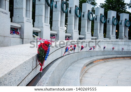 WASHINGTON, D.C. - MAY 27, 2013: People visit and lay flowers at the World War II Memorial on May 27, 2013, in Washington, D.C.