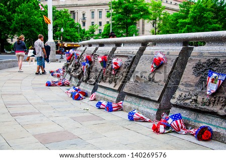 WASHINGTON, D.C. - MAY 27, 2013: People visit and lay flowers at the United States Navy Memorial on May 27, 2013, in Washington, D.C.