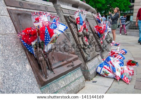 WASHINGTON, D.C. - MAY 27: People visit and lay flowers at the United States Navy Memorial on May 27, 2013, in Washington, D.C.