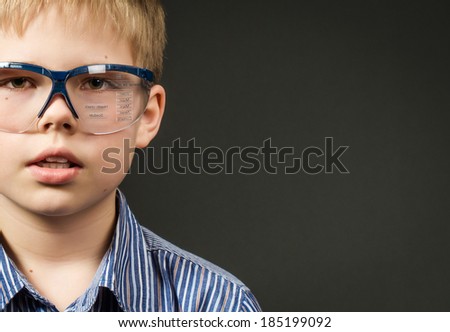 Picture of cute boy with digital glasses. New technologies. Copy space.