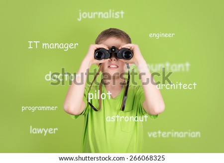 Choosing future profession concept. Cute boy with binoculars on green background looking for future job.