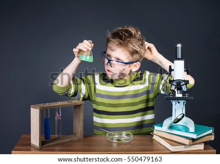 Kid making science experiments. Crazy funny dirty scientist. Education and science concept.
