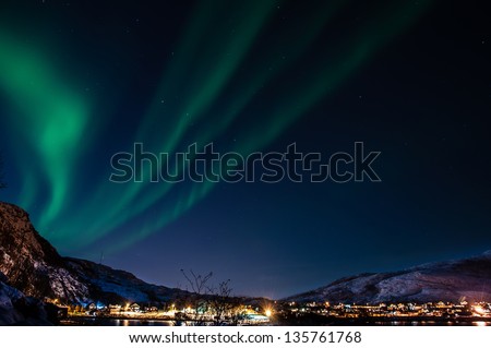 Northern lights (aurora) seen at night at Ersfjordbotn (Troms, Norway).