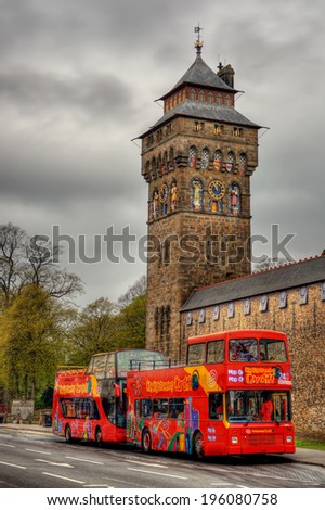 CARDIFF, WALES - APRIL 20, 2014: sightseeing bus in front of Cardiff Castle, taken using the HDR-technique