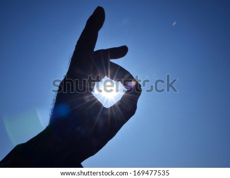 Sun in the hands on sky