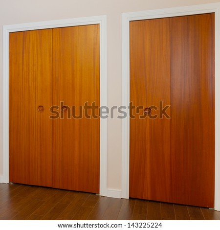 Wooden doors of the closets in the bedroom