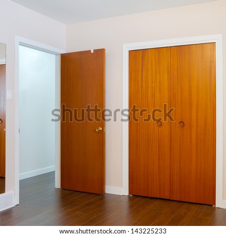 Wooden doors of the closets in the bedroom