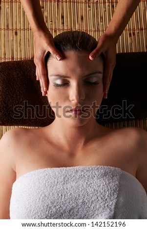 Spa Woman. Beautiful young woman relax in Spa having a massage