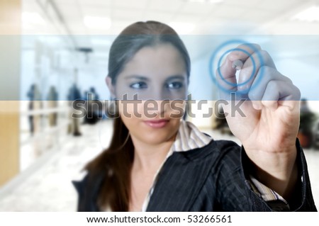 Business woman touch digital interface with a pen (Business and technology concept)