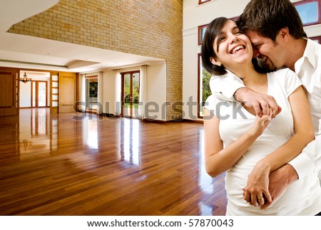 Young happy couple at their new house