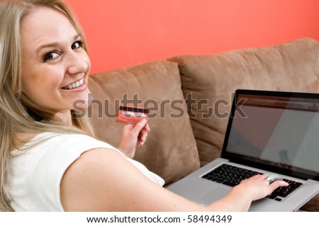 Beautiful young girl shopping online, e-commerce concept