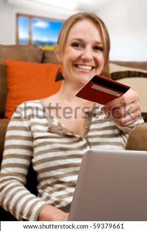 Beautiful young girl shopping online, e-commerce concept