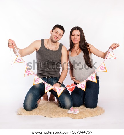 Portrait of happy couple expecting a baby. Pregnancy, family.