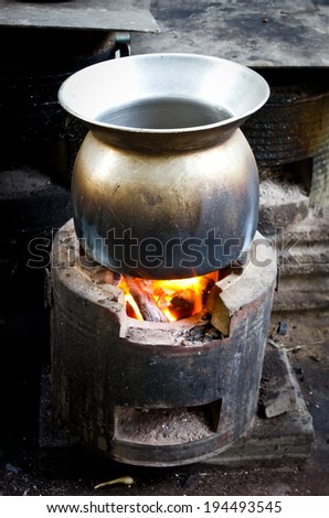 Old metal pot on the fire
