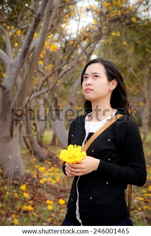 Asian woman thinking in looking pensive and happy. Portrait of an attractive fashionable young brunette woman.