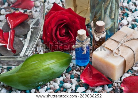 Composition with sea salt, soap, towel, infusion of herbs and flower
