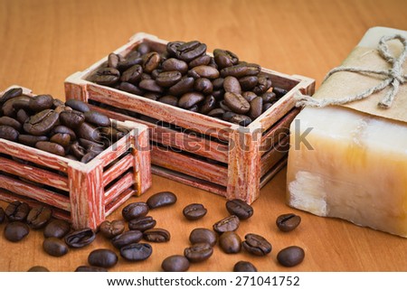Composition with grains of coffee, soap and decorative objects on a wooden background