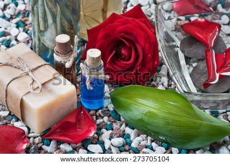 Composition with sea salt, soap, towel, infusion of herbs and flower