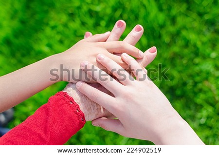 Old and young hands. Hands of the old woman  76 years