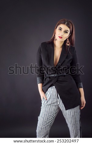 Woman in smart casual fashion look. Stripes and Low-cut blazer for Valentine's Day party