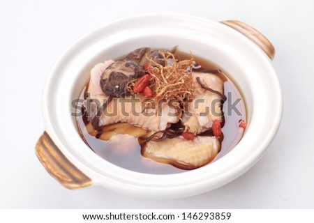 Chinese herbal soup with meat in clay pot