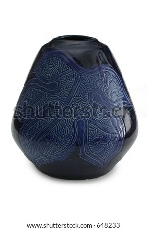 Dark blue glazed vase with a leaf etching on its side.