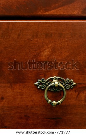 Rubber-wood drawer with dark reddish varnish and antique ring-pull handle